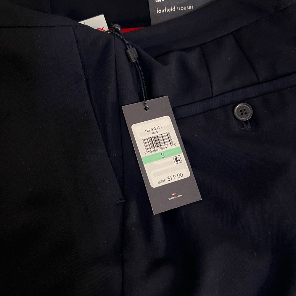 Tommy Hilfiger trouser sits below natural waist relaxed fit at hip, thigh & leg.